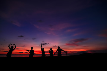 Silhouette of photographers on the sunset.