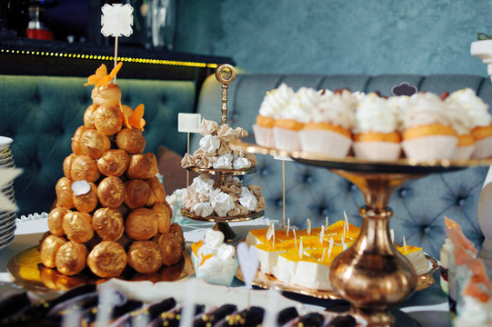 dressing table with sweets, candy pyramid decorated with orange