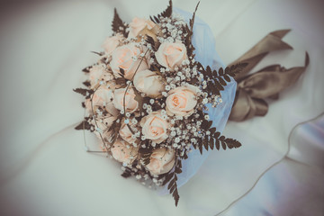 Obraz premium bridal bouquet on the weddind dress