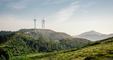 Mountain landscape with wind turbines in the background