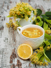 Cup of herbal tea with linden flowers