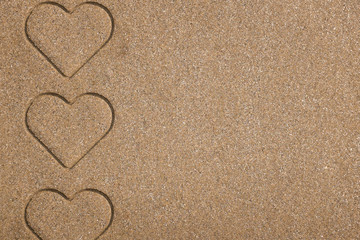 Fototapeta na wymiar Beach background . heart on sand