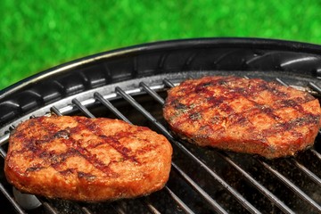 BBQ Hamburger Patties On The Hot Charcoal Grill