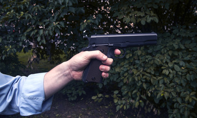 hand with gun Colt