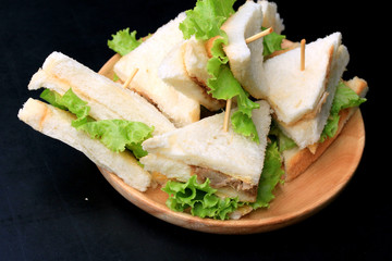 tuna sanwich on black background
