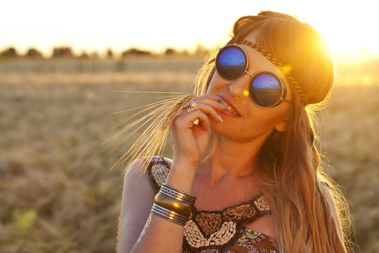Beautiful hippie girl at sunset