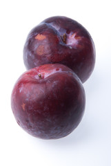 Plum. Ripe plum fruit on background