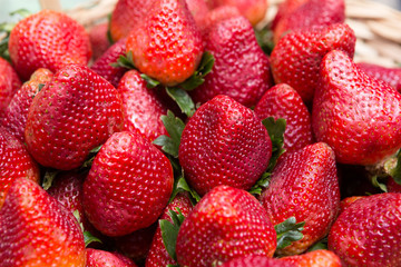 Sweet ripe strawberries in wicker basket