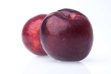 Plum. Ripe plum fruit on background