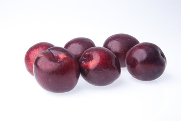 Plum. Ripe plum fruit on background
