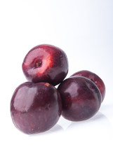 Plum. Ripe plum fruit on background