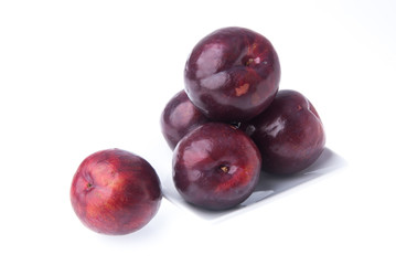 Plum. Ripe plum fruit on background