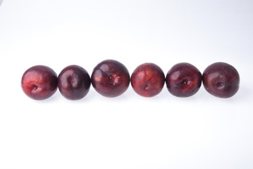 Plum. Ripe plum fruit on background