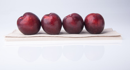 Plum. Ripe plum fruit on background