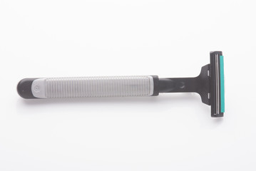 Safety shaver or razor on background