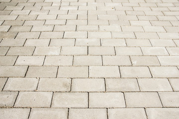 Gray block pavement perspective background.
