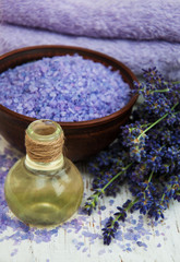 Fototapeta na wymiar lavender oil with bath salt and fresh lavender