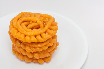 Indian Jalebi in a white plate. Jalebi is one of kerala's favorite dessert