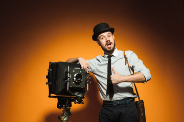 young man with retro camera 