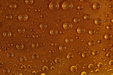 Water drops on the brown surface