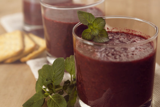 Fresh blackberry juice with mint in glasses