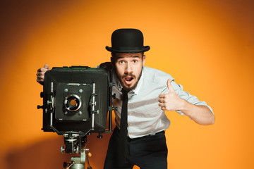 young man with retro camera 