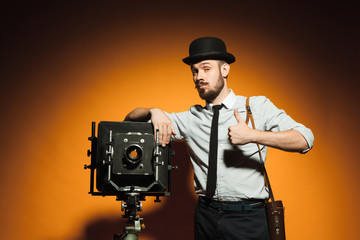 young man with retro camera 