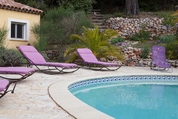 Loungers near the pool in a villa in Provence