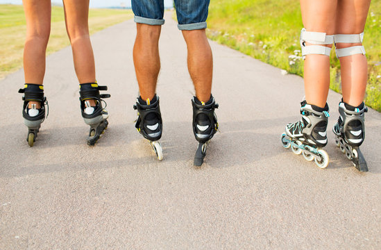 close up of legs in rollerskates skating on road