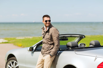 happy man near cabriolet car outdoors