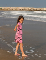 beautiful Little Girl with pink dress with small black hearts of