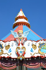 Detail of a carousel with cupids, close-up