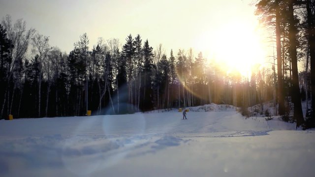 base of the ski resort in Siberia oo background sunset and