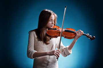 beautiful girl plays on violin