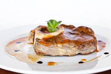 Gourmet thick juicy fillet steak medallion grilled to perfection and served topped with vegetable sauce