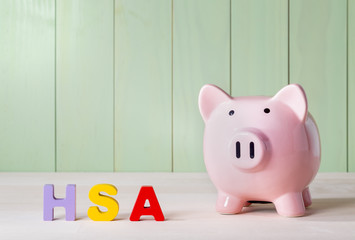 HSA theme with wood block letters and a piggy bank