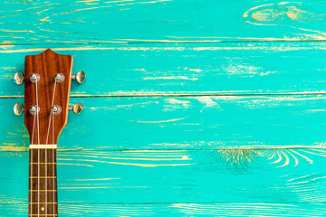 Naklejka premium Ukulele Background / Ukulele / Ukulele on Blue Wooden Background