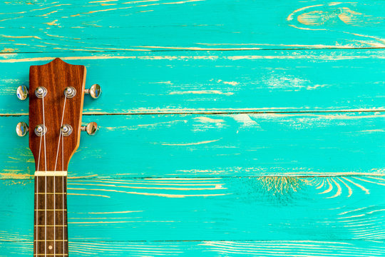 Ukulele Background / Ukulele / Ukulele on Blue Wooden Background