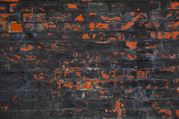 Old brickwork, covered with black tar. Texture brick, background - 88565423