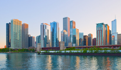 Fototapeta na wymiar Chicago Illinois skyline at sunset with illuminated downtown buildings