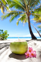 Tropical fresh cocktail on white beach