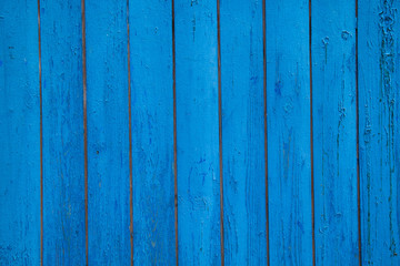 Textured wood planks painted in blue, grunge background