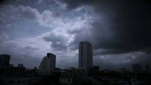 Timelapse of raincloud over building