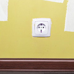 Electrical outlet on wall in room