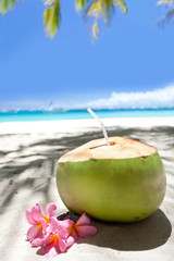 Tropical fresh cocktail on white beach