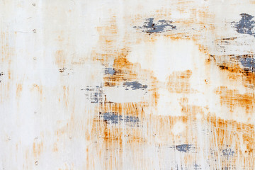 A background of peeling paint and rusty old metal