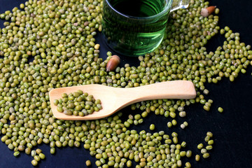 green beans dried and water chlorophyll on black background.
