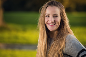 Portrait of a young woman at urban park