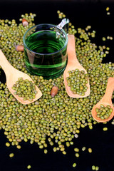 green beans dried and water chlorophyll on black background.