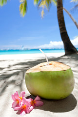 Tropical fresh cocktail on white beach